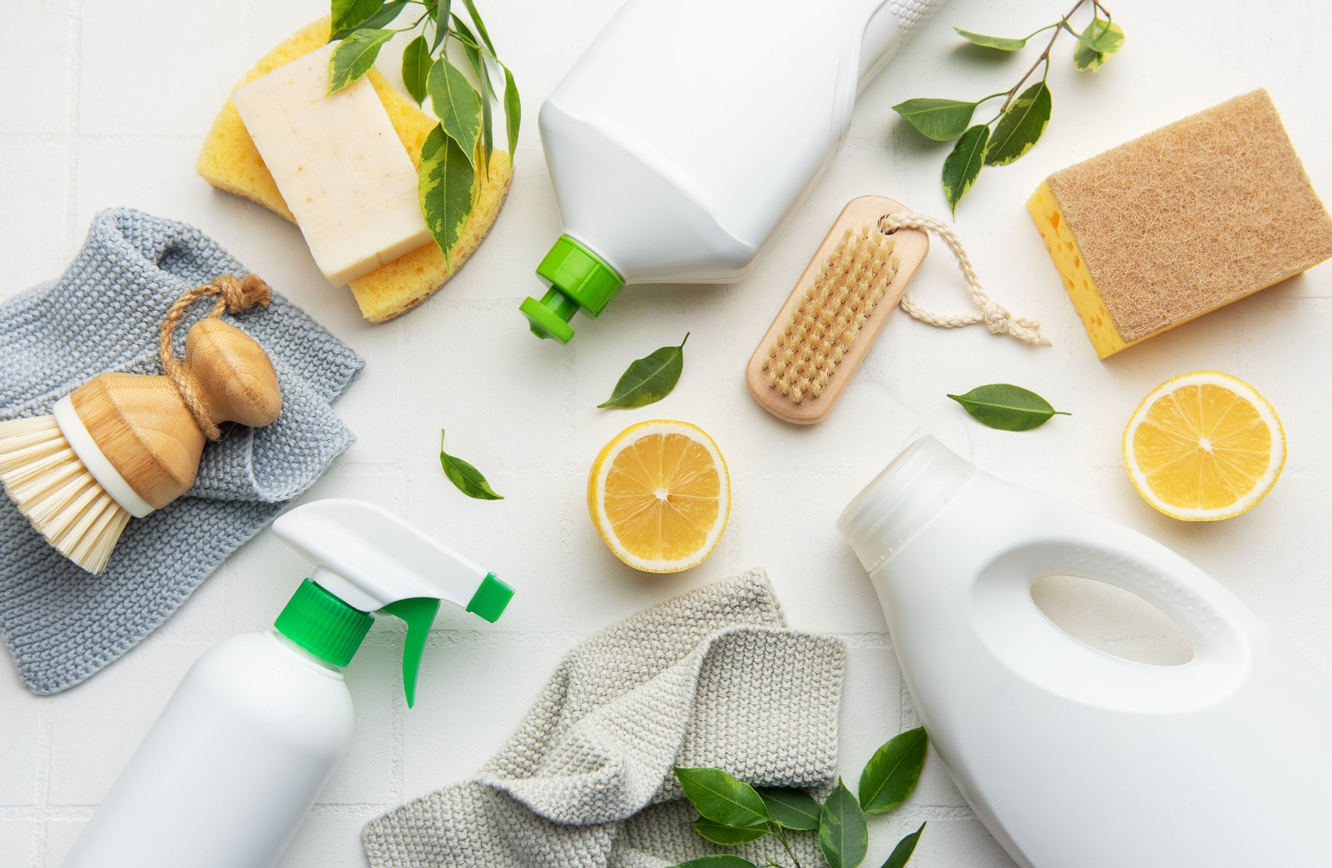 Eco friendly cleaning products promoting sustainable lifestyle with lemons and brushes